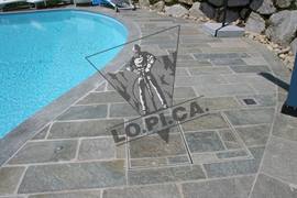 Swimming pool in Luserna stone with naturally split surface